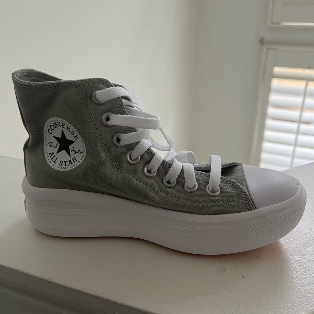 Women’s high top Converse sneakers
